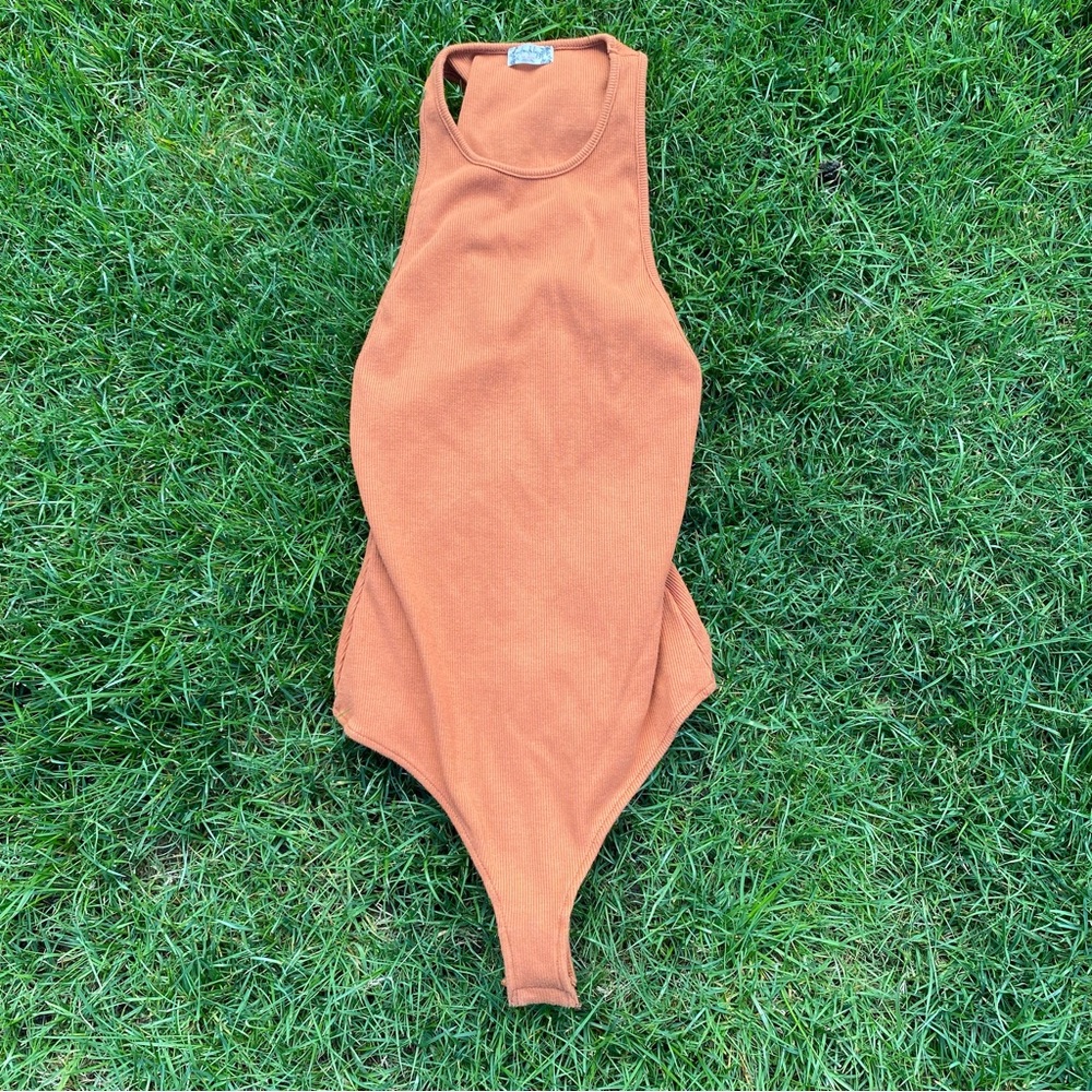orange free people bodysuit 🧡
